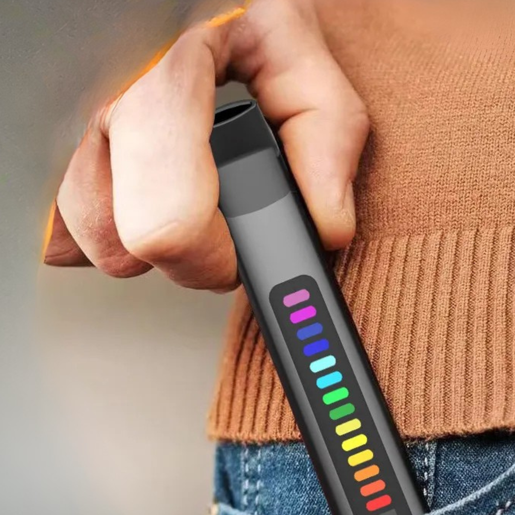 Person holding Prolungs U-Pro Portable Digital Breath Trainer showing LED progress bar during respiratory training session