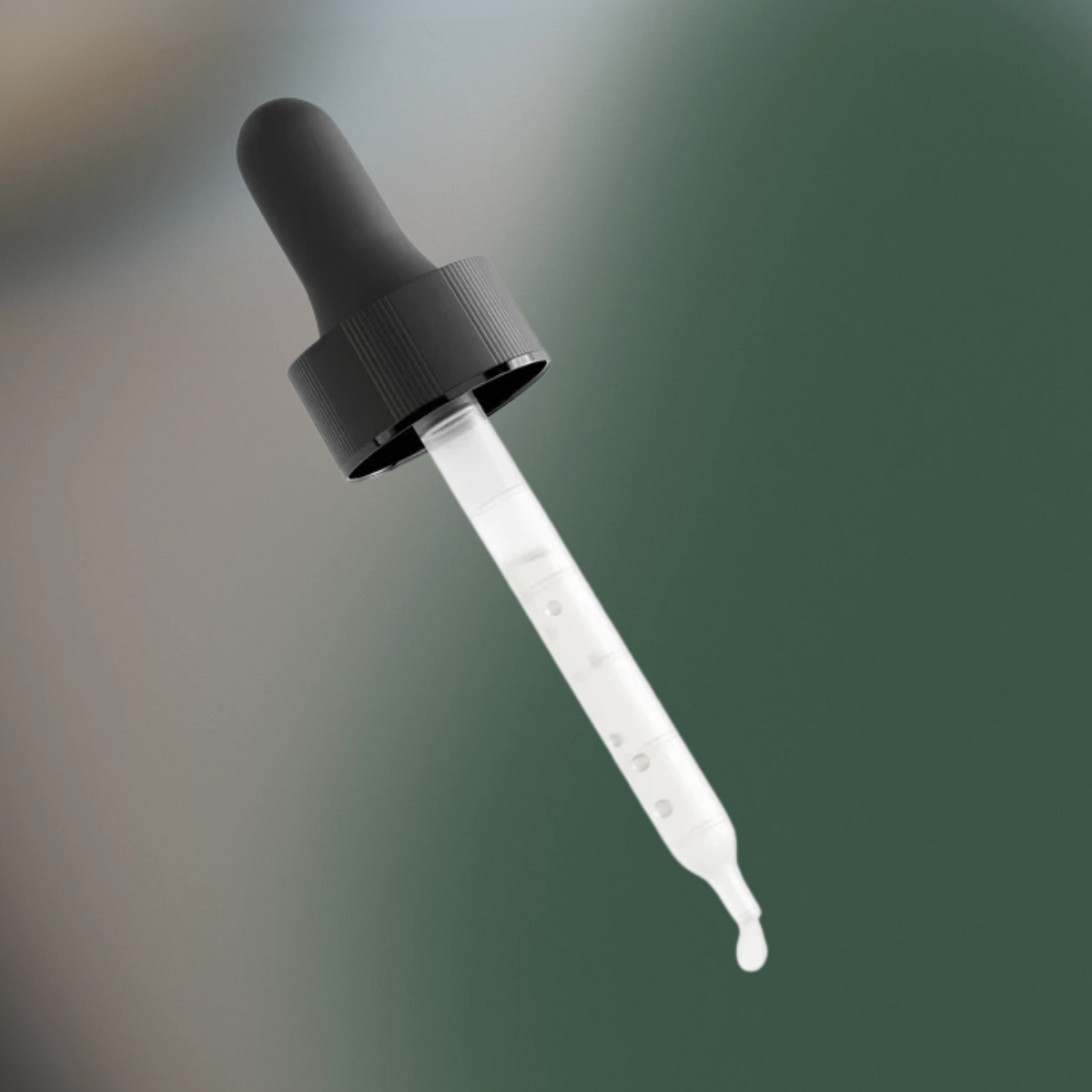 Black dropper bottle with clear liquid on a gradient background